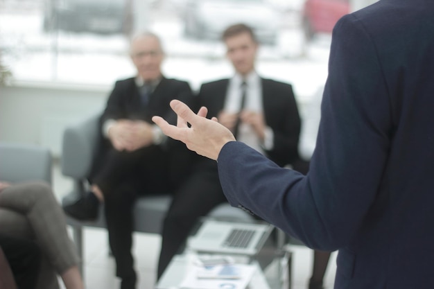 Close up businessman reading a report at a working meeting