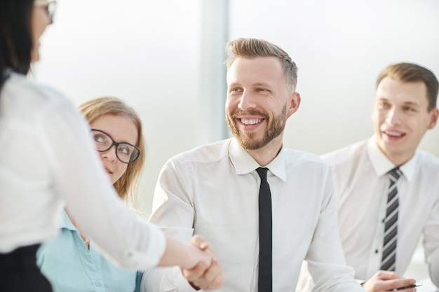 Close up.businessman shaking hands with his business partner. concept of cooperation