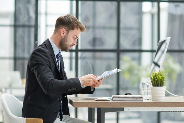 Close Up Of Businessman Taking Folders From Hand