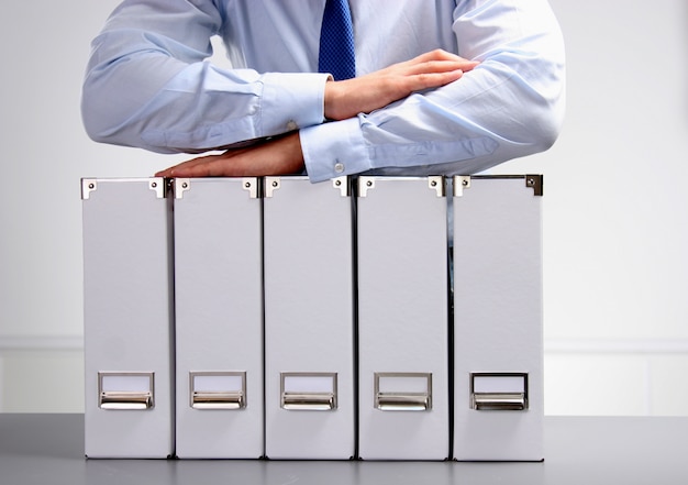 Close-up of the businessman with office folders