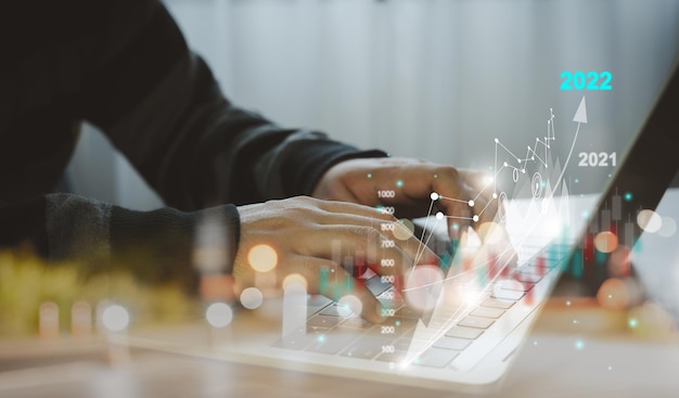 Close up Businessman working on table office deck for business growth up or stock market 2022