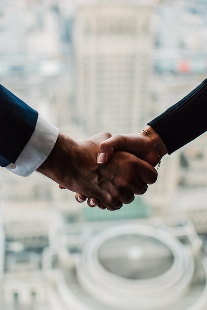 close-up of businesspersons holding hands