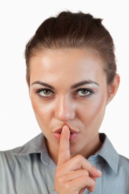 Photo close up of businesswoman asking for silence