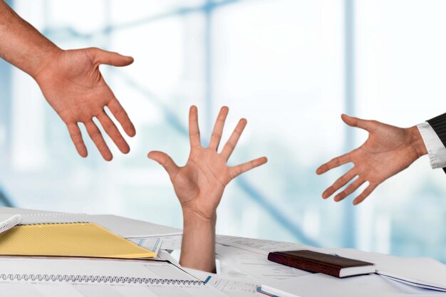 Close up of businesswoman hand in stack of papers