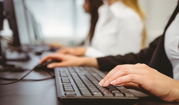 Close up of a businesswoman typing on keyboard