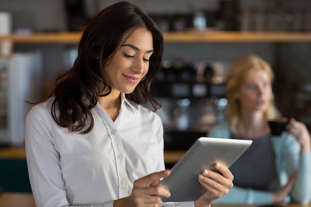 Close-up of businesswoman using digital tablet