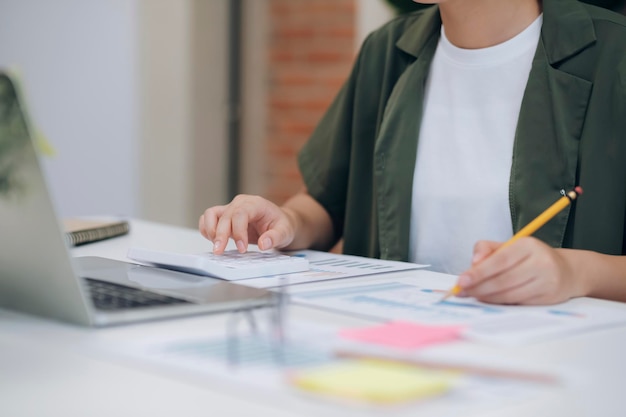 Close up of Businesswoman working at office using laptop