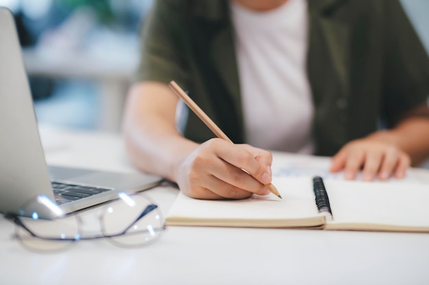 Close up of Businesswoman working at office using laptop