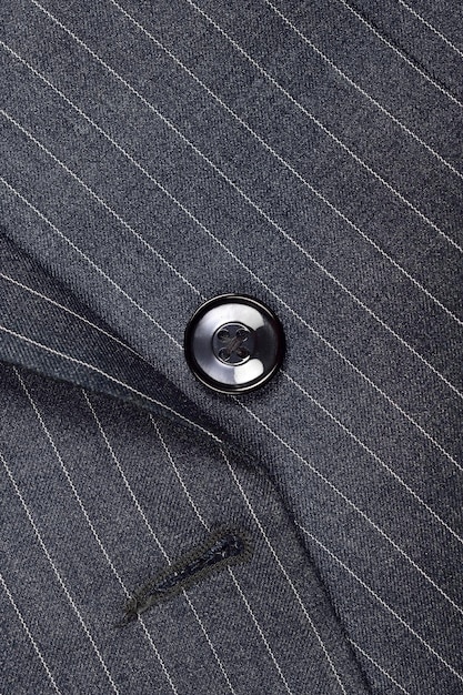 Close up of button on pinstripe suit