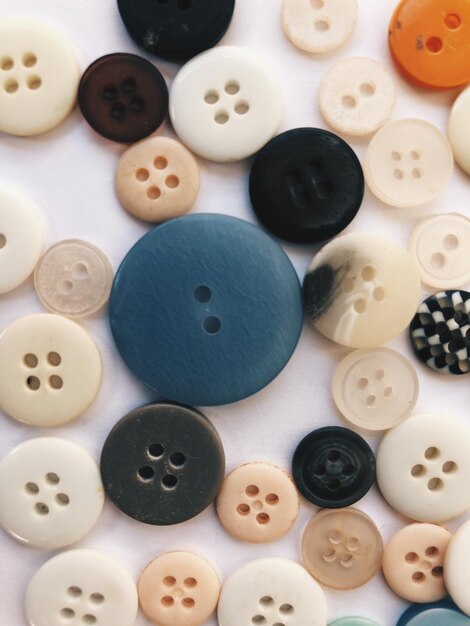 Close-up of buttons on shelf