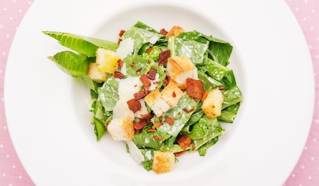 Close up of caesar salad on a table.