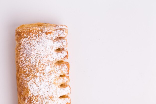 Photo close-up of cake against white background