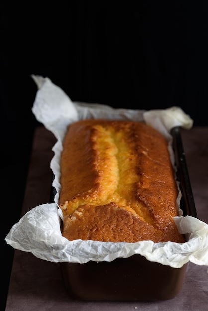 Close-up of cake on table against black background