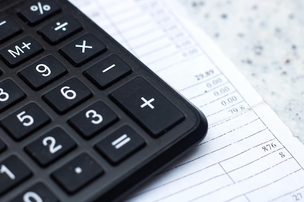 close up of a calculator on top of a sheet of paper