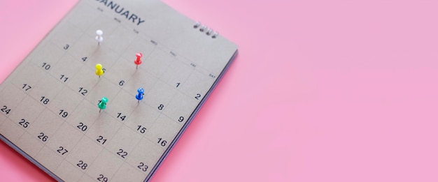 A close up of the calendar on the brown table the concept of planning