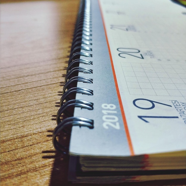 Close-up of calendar on table