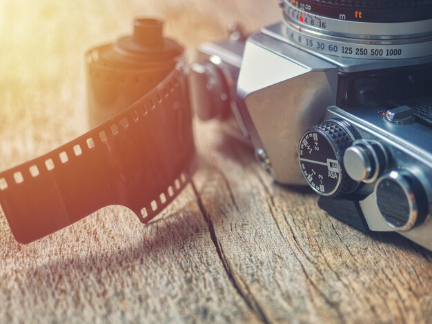 Close-up of camera and film reel on table