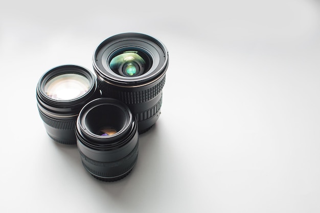 Close-up of camera lenses against white background