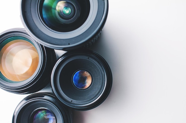 Close-up of camera lenses over white background