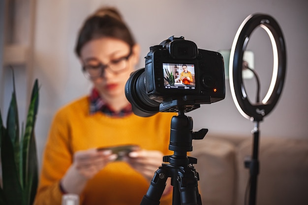 Close up camera screen, woman beauty blogger makes video review