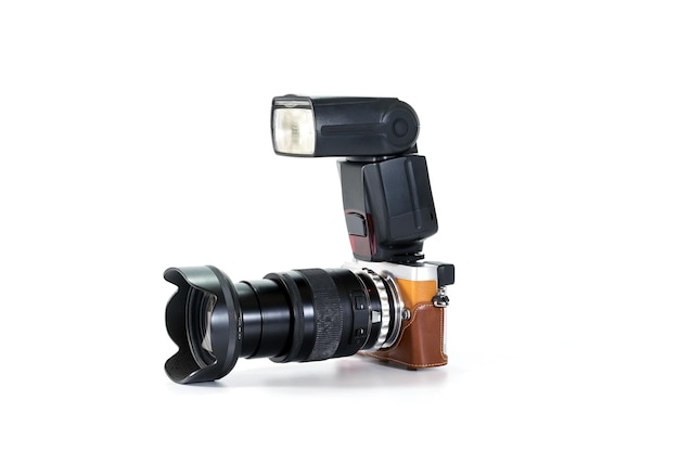 Photo close-up of camera with flash light against white background