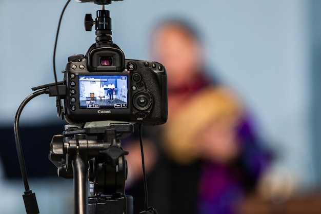 close-up of camera with women in background