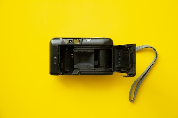 Photo close-up of camera on yellow background