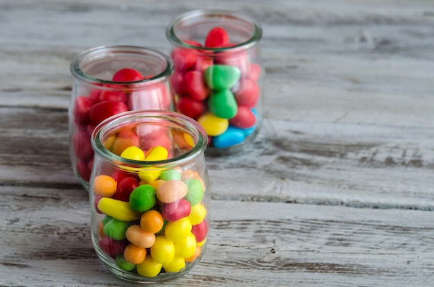 Close-up of candies in glass jars