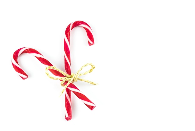 Photo close-up of candy canes over white background