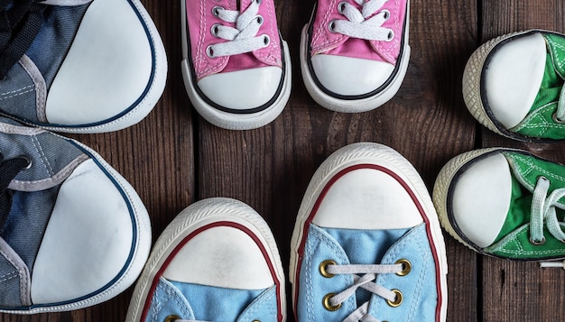 Photo close-up of canvas shoes on hardwood floor