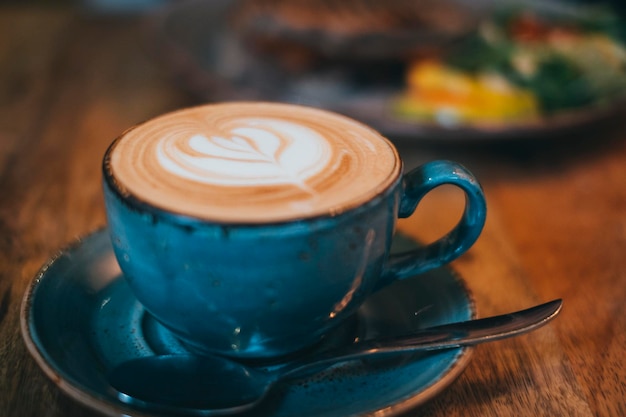 Close-up of cappuccino served on table