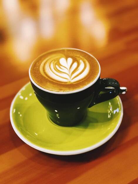 Close-up of cappuccino on table