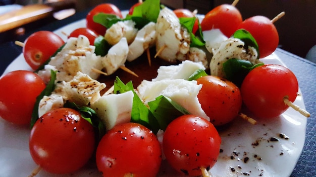 Close-up of caprese salad served on table