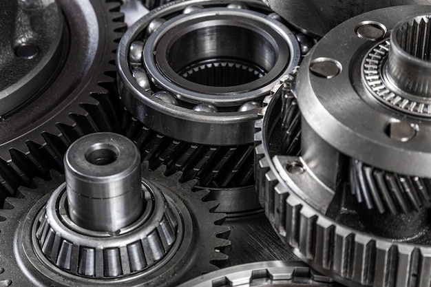 Close-up of a car gearbox. Metallic shiny gears for planetary gearshift. Industrial metal gears for Background