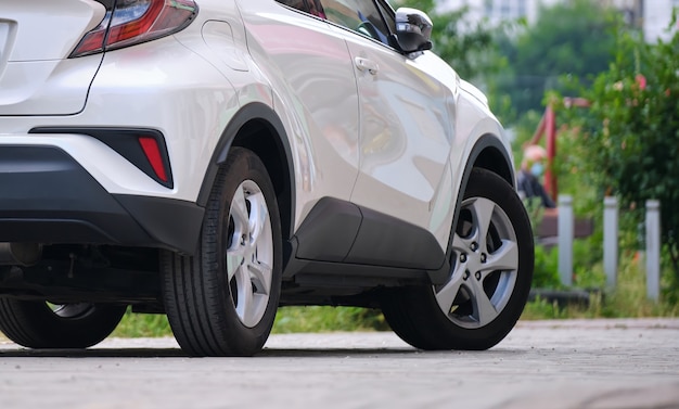 Close up of a car parked on city street side.