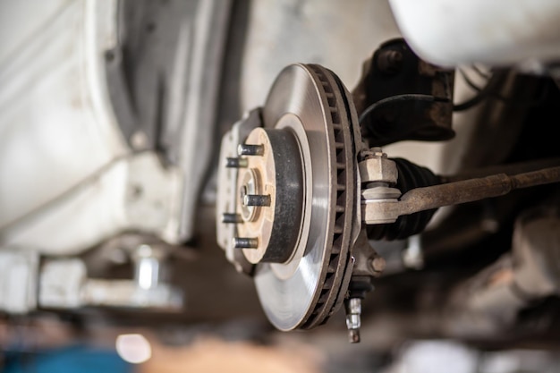 A close up of a car's brake caliper Disc brake of the vehicle for repair