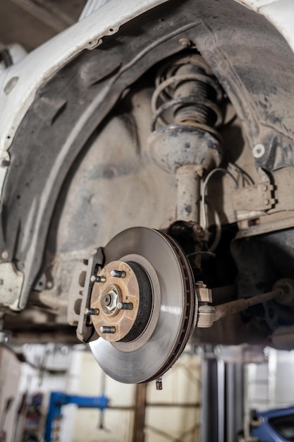 A close up of a car's brake disc and a brake disc Disc brake of the vehicle for repair