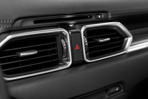 Close up car ventilation  system and air conditioning - details and controls of modern car.