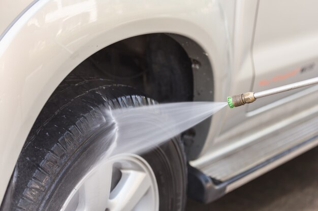 Close up Car washing with high pressure water jet