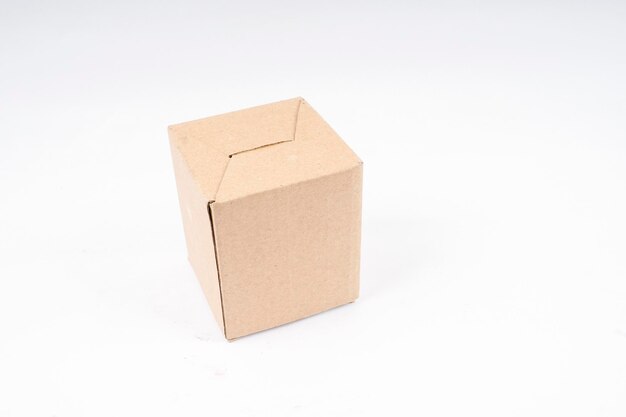 Close-up of cardboard box on white background