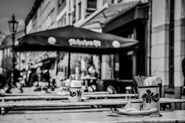 Close-up of carousel on table against buildings in city