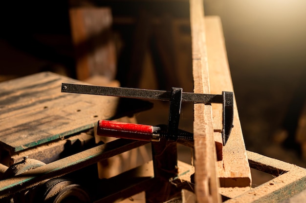 Close-up of a carpenter using a circular saw or a tool to cut wooden planks To make furniture in homes and residences, hotels, rooms made of wood.