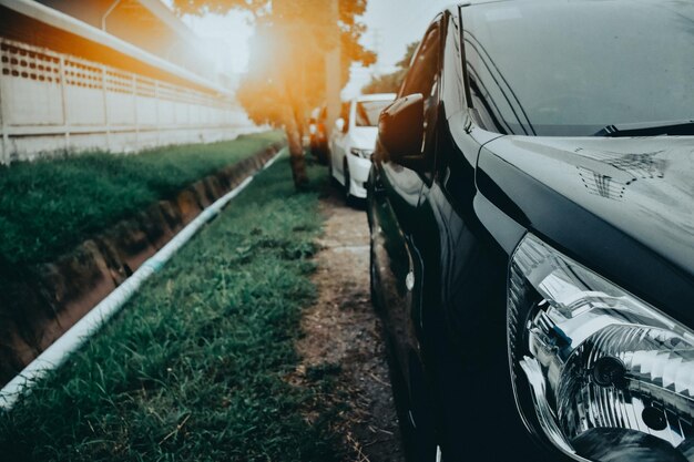 Close-up of cars parked on street