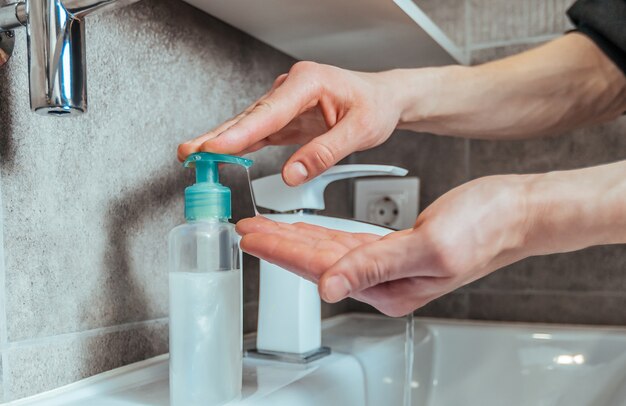 Close up. casual man washes his hands thoroughly .