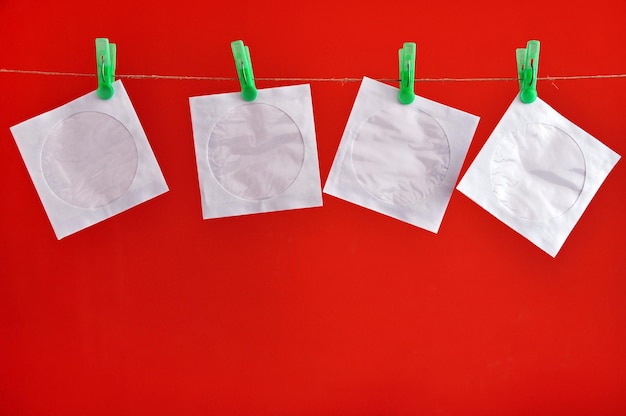 Close-up of cd case drying against red background