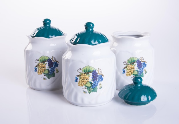 Photo close-up of ceramic containers against white background