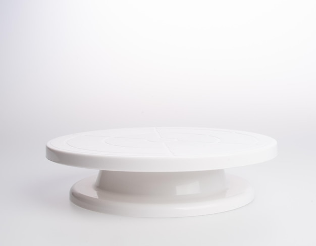 Photo close-up of ceramics cakestand against white background