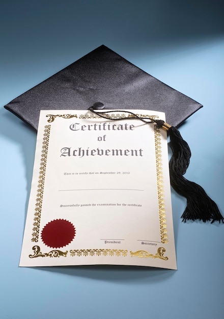 Close up of certificate and mortar board