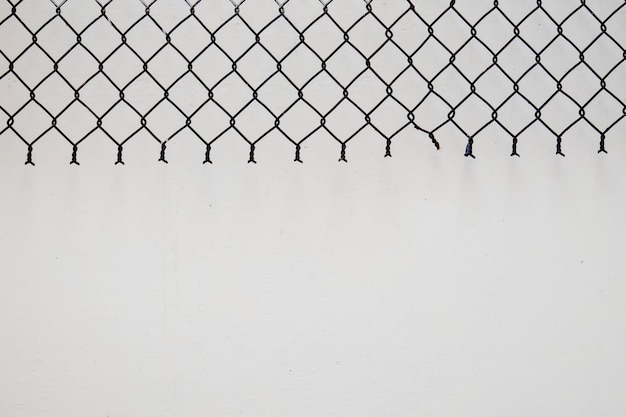 close-up of chainlink fence against sky during winter