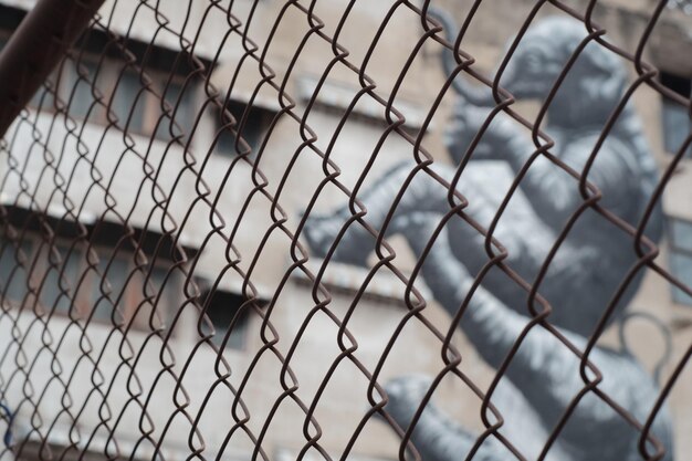 Close-up of chainlink fence against sky